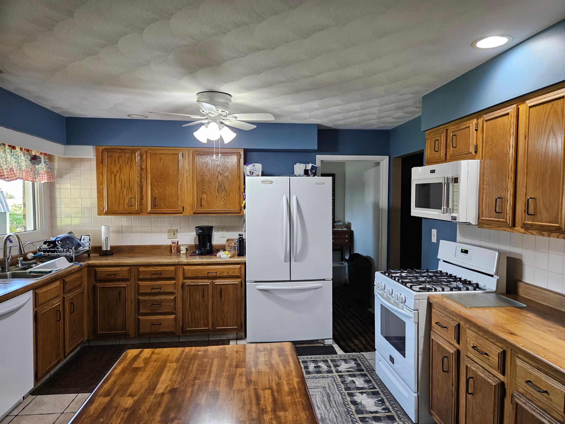 Kitchen before remodel — cabinetry and ceiling