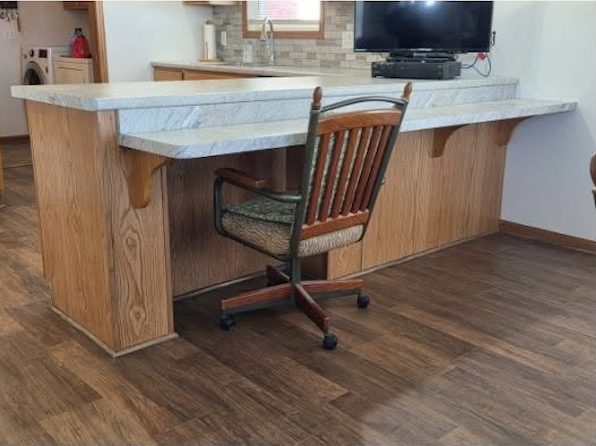 Kitchen after remodel — new countertops and flooring
