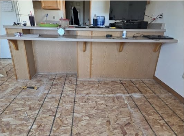Kitchen before remodel — bar and flooring
