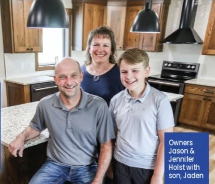 Owners Jason and Jennifer Holst with their son Jaden in a finished kitchen